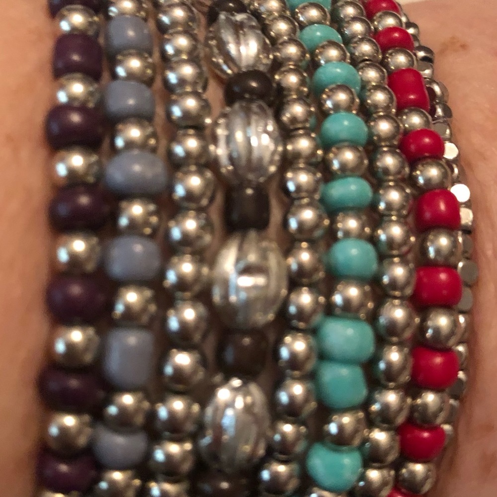 Nine strand elastic beaded bracelet. 7 1/4” comfortable fit.